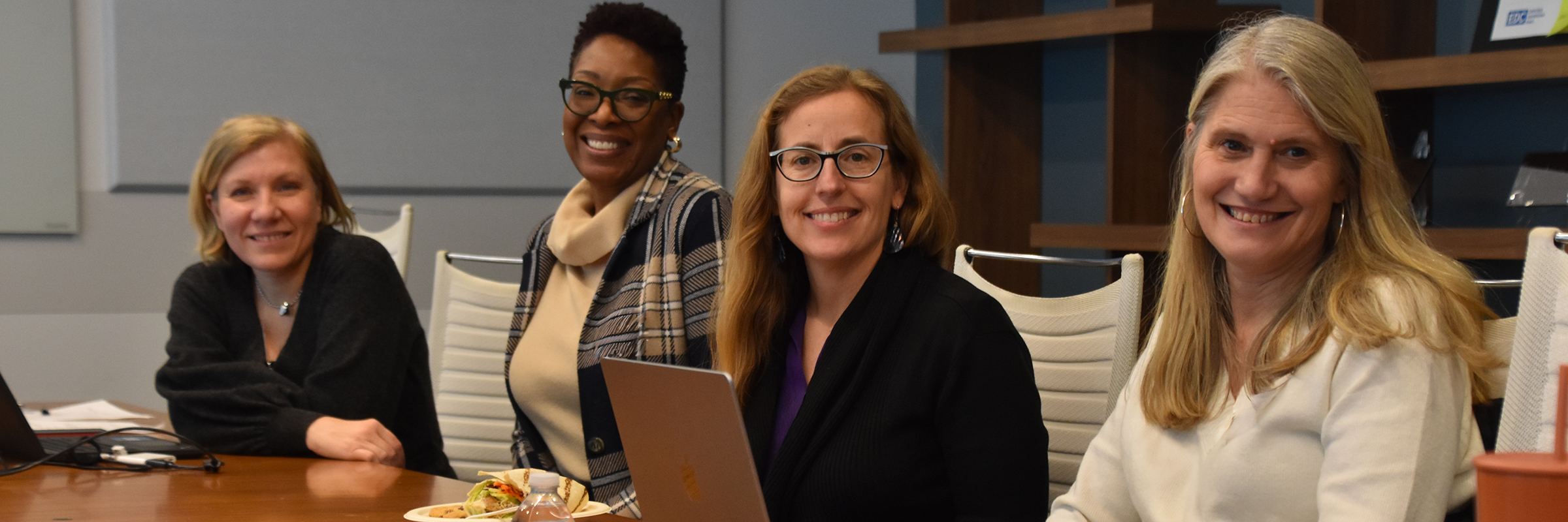 Four women participants at a conference table at the 2026-01-23 Beyond the Checklist event