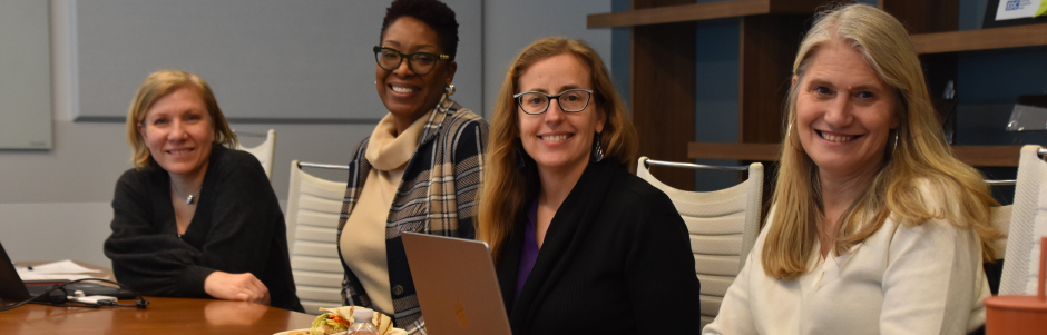 Four women participants at a conference table at the 2026-01-23 Beyond the Checklist event