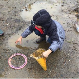 child outside exploring