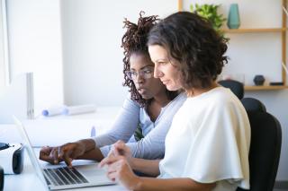 female colleagues watching a webinar