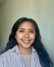 headshot of woman with long black hair